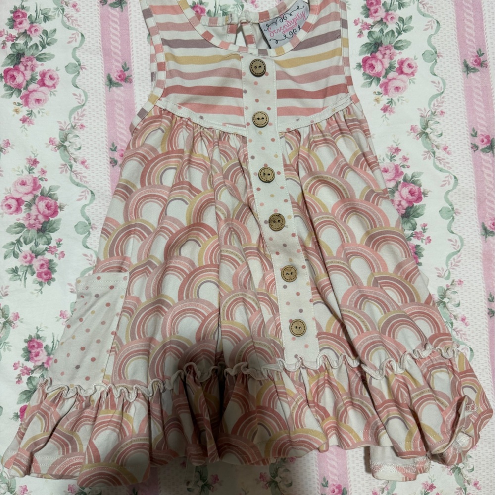 Serendipity dress in a rainbow and stripe pattern